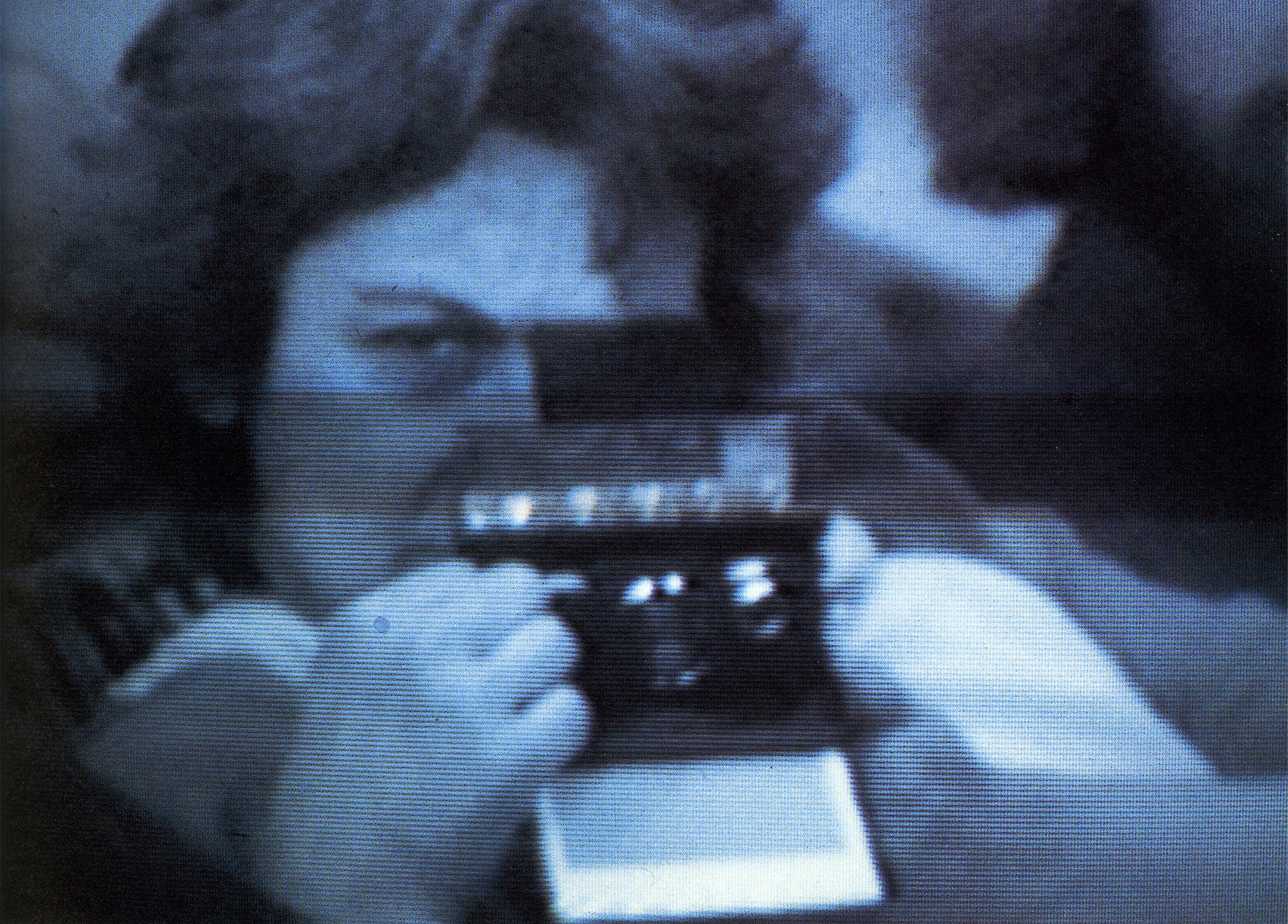 Muriel Cooper holding a Polaroid camera